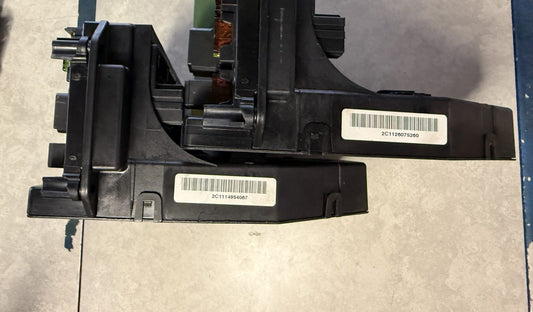 Two Mercedes front SAM modules on the bench at a West Palm Beach electronic laboratory