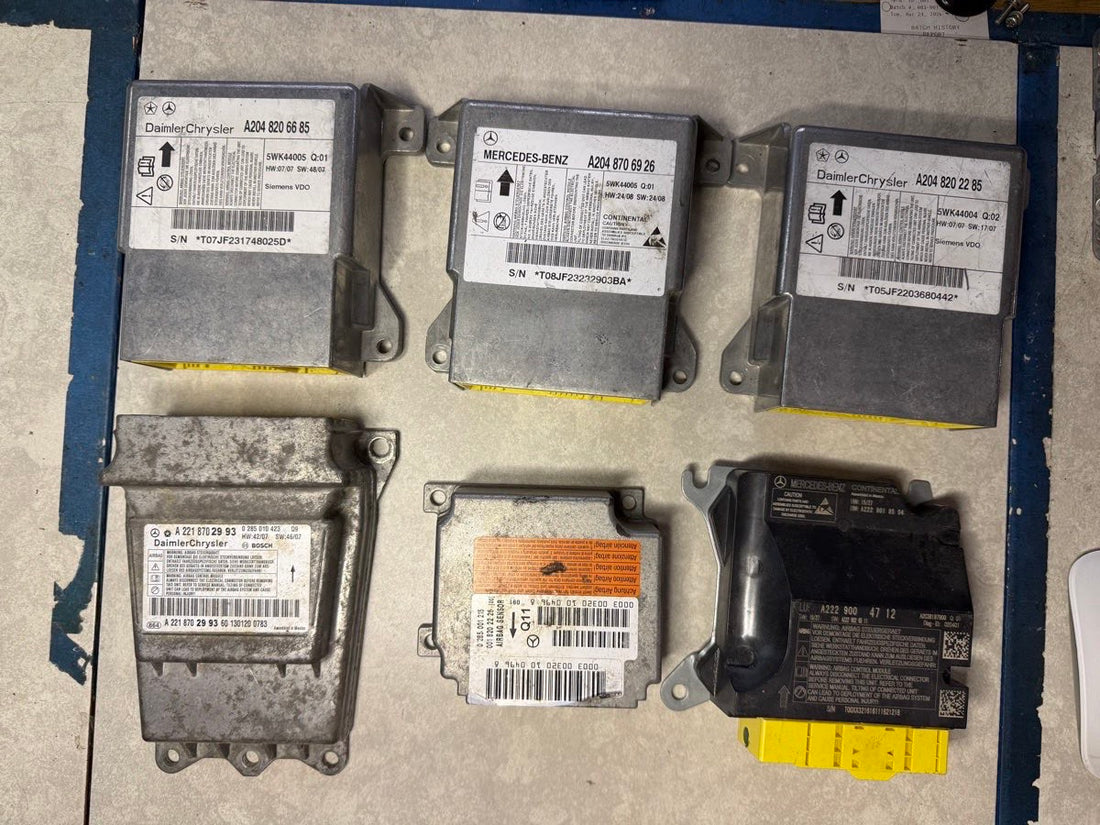 Mercedes-Benz and DaimlerChrysler SRS airbag modules with W204, W210, W221, W222 part number labels reset on the ECU Team bench, West Palm Beach FL